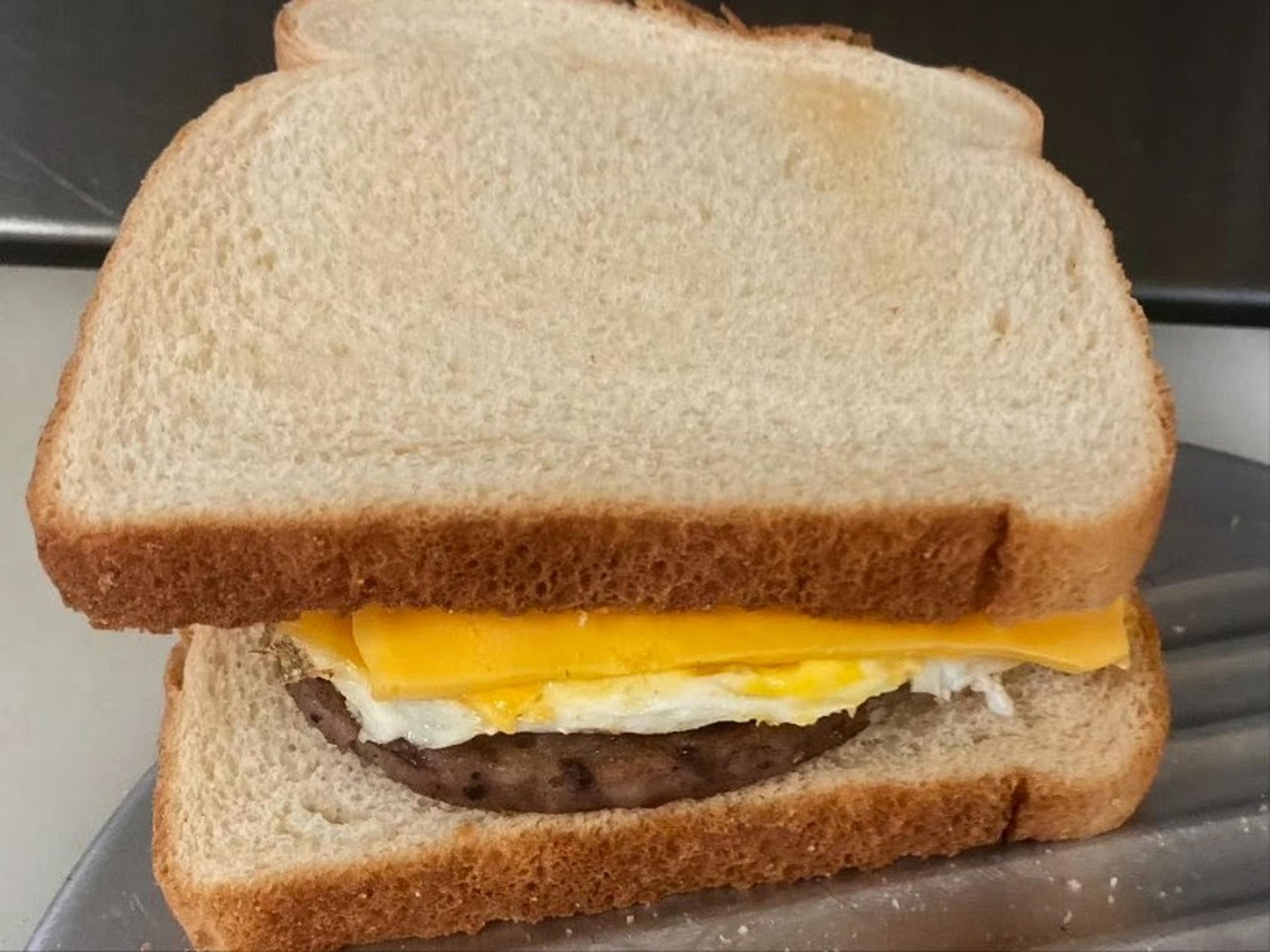 Bread, egg and cheese with sausage
