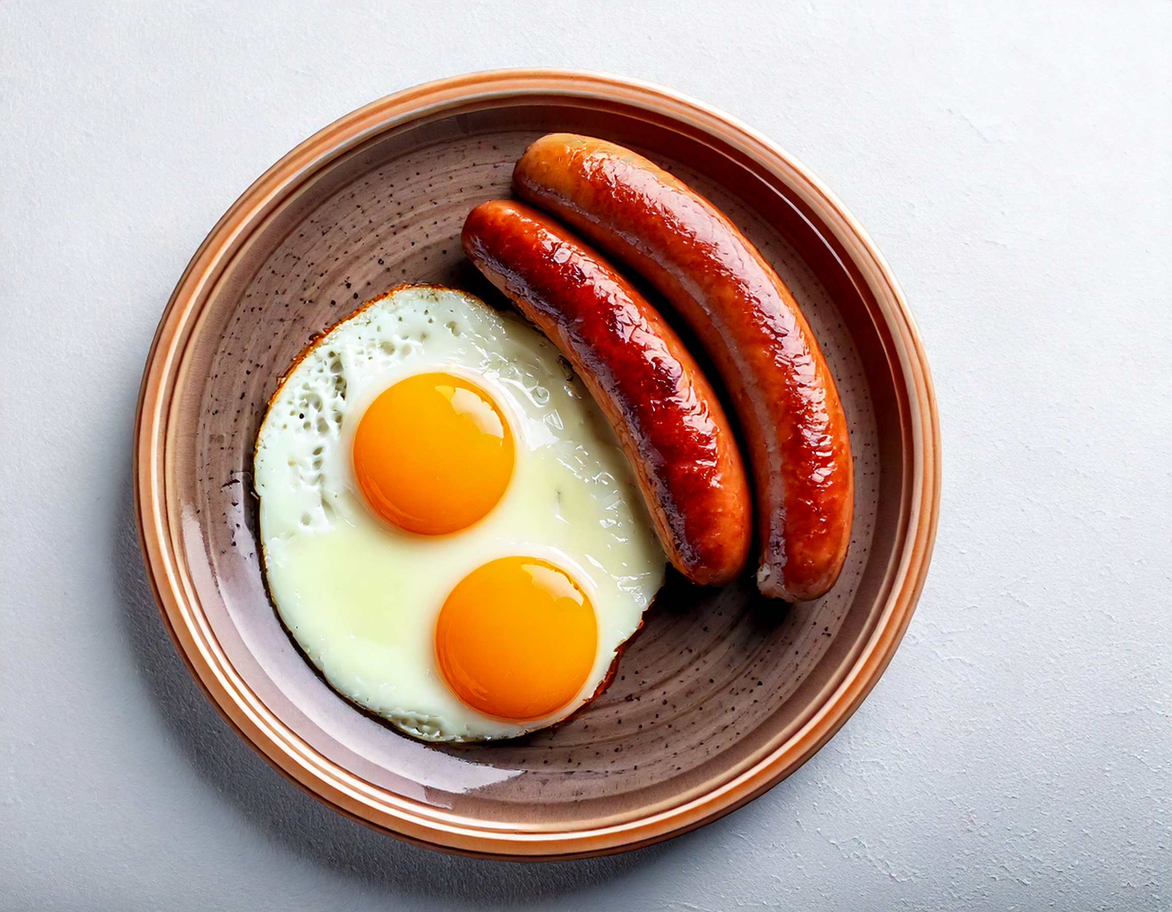Two Eggs w/ Beef Sausage or Canadian Bacon
